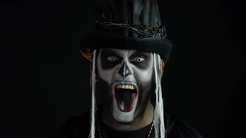 Man in Skeleton Makeup Sticks Tongue Out