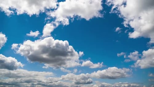 Billowing Clouds Drifting in Blue Sky Time-Lapse