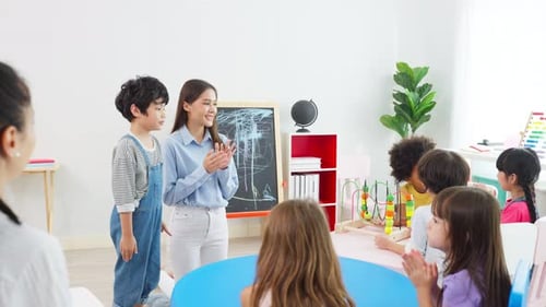 Teacher with Students in Bright Classroom Setting