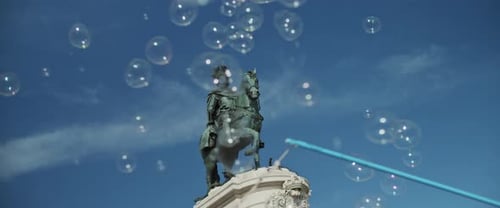 Equestrian Statue and Soap Bubbles on Sunny Day