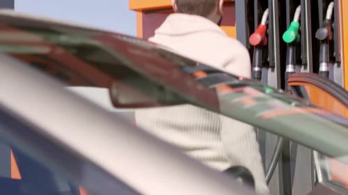 Man Filling Car with Petrol