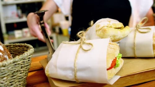 Three Fresh Sandwiches Wrapped in Paper