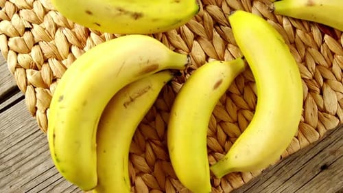 Bananas arranged on place mat