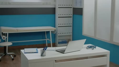Clean Doctor's Office with Examination Table and Computer