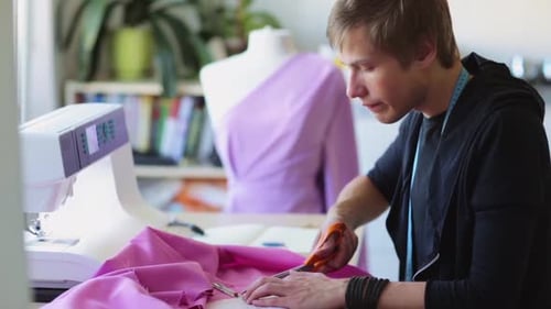 Fashion Designer with Cloth Making Dress at Studio