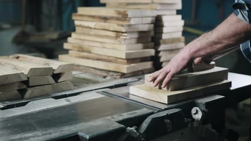 Closeup of Hands and Wood Workpiece on Planer