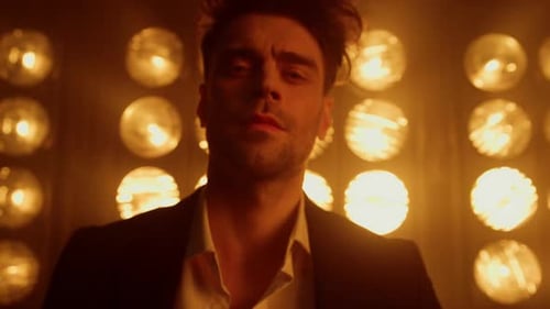 Sexy Man Model Walking Confidently in Spotlights Wearing Elegant Suit Close Up