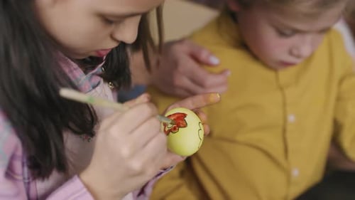 Girl Painting on Easter Egg