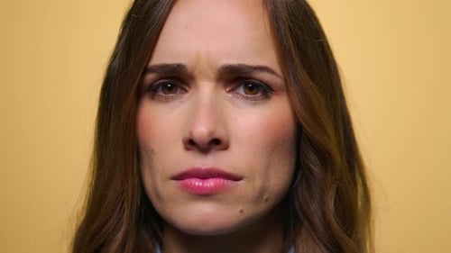Woman's Face with Expressions on Yellow Background