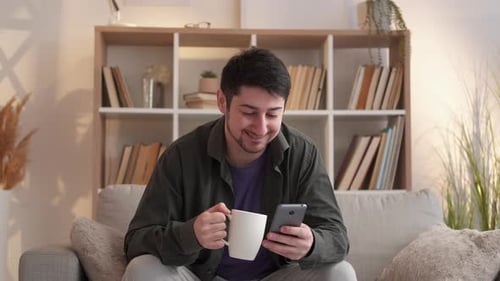 Phone Texting Internet Browsing Man Couch Home