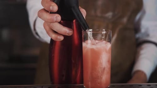 Crafting a Pink Cocktail with Soda Siphon