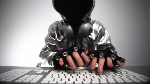Computer Hacker in Silver Jacket