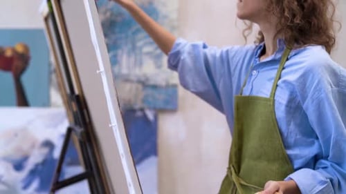 Woman Painting on Canvas in Art Studio