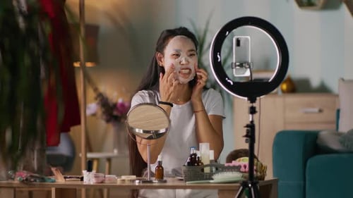 Asian Mother Shooting Video for Beauty Blog Near Kid
