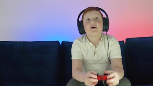 Gamer Discussing Tactics with Teammates While Talking Into Headset
