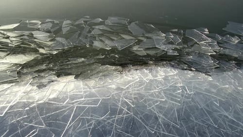 Broken ice sheets moving along the shoreline at Utah Lake