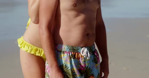Couple standing together at beach