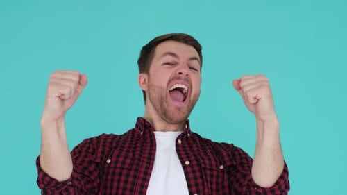 Excited Man Yelling with Fists Raised