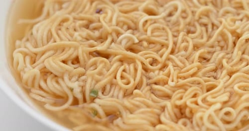 Close Up of Noodles in Broth
