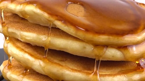 Pancakes Stacked High with Dripping Syrup