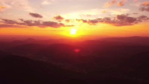 Golden Sunset Over Rolling Mountain Ridges
