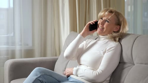 Woman Relaxing at Home Talking on Phone