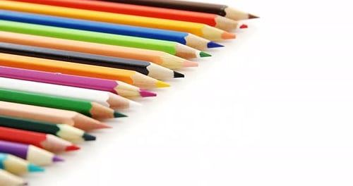 Colored pencils arranged in a row