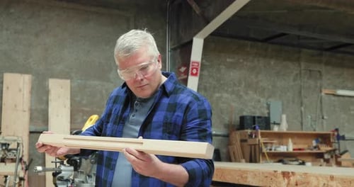 Carpenter at work in woodshop