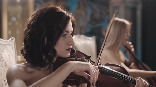 Women Playing Violin and Cello in Room