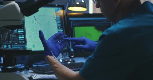 Scientist Examining Futuristic Data in a High-Tech Lab