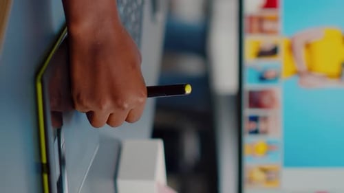 Close Up of African Photo Retoucher Holding Stylus Pen Editing Customer Photo