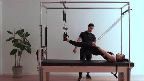 Woman Working Out With Pilates Machine