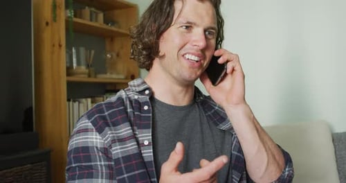 Young Adult Talking on Phone at Home