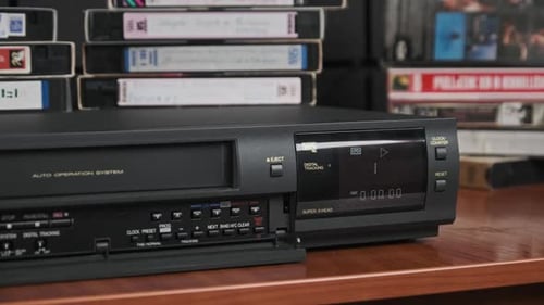 Insert VHS Cassette Into VCR and Push Play Button