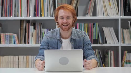 Young Adult Waving During a Video Call