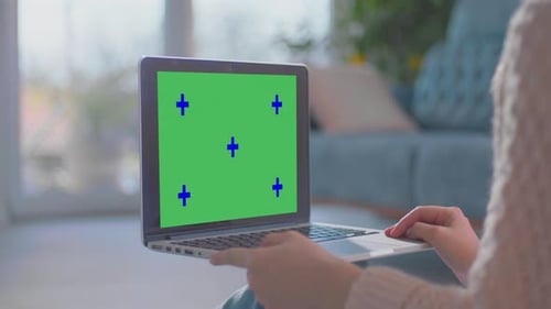 Laptop with Green Screen in Home Setting
