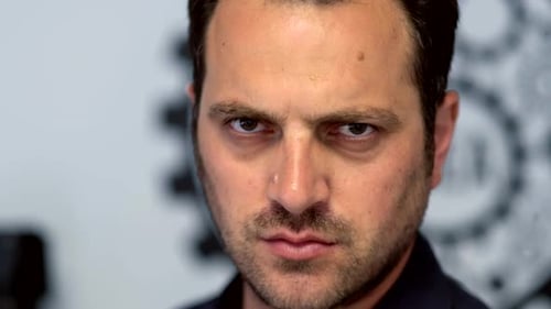 Intense Man Stares Directly at the Camera
