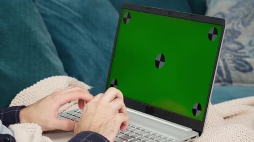 Young Man Hands Typing on Keyboard of Laptop Chroma Green Screen of Computer
