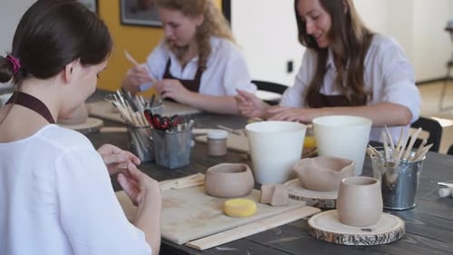 Beautiful Young Female Artist Girls Creating Handmade Pottery in Modern Art Studio. Education Kids