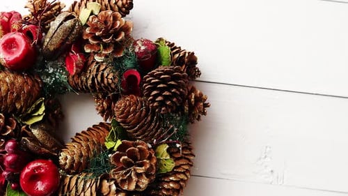 Christmas Holiday Wreath with Ornaments on White Wood