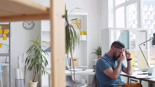 Man Working at Computer in Bright Modern Office