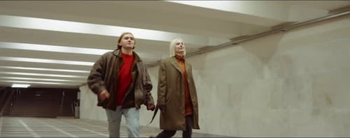 Young Couple Walking in Underpass