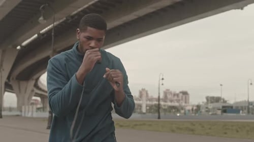 Athletic Man Shadow Boxing Outdoors