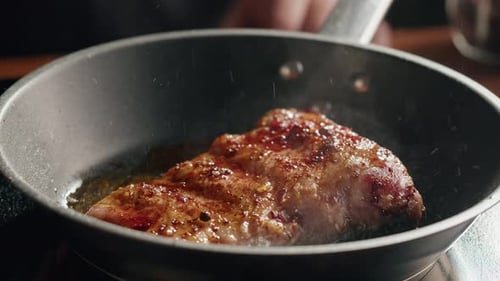 Chef Frying Ribs with Flambe Technique