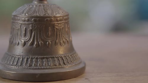 Ornate Bronze Bell with Decorative Carvings