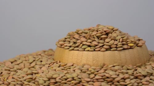 Dry Lentils in Wooden Bowl Close Up