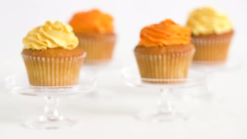 Delicious Cupcakes with Yellow and Orange Frosting