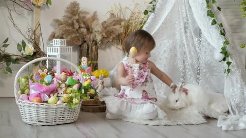 Child Interacts with Easter Bunny in Festive Setting