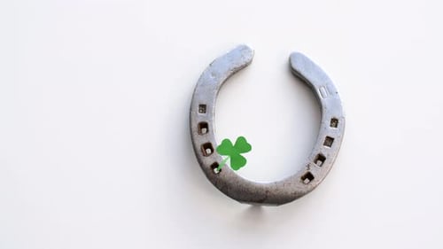 Horseshoe and Shamrock on White Background