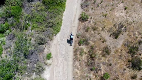 Aerial View of Riding Mountain Bike in a Small Singletrack Trail in the Mountain